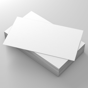 A stack of blank white business cards neatly arranged on a sleek grey surface.